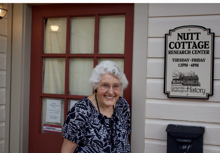 Martha Boice in front of Nutt House, Centerville